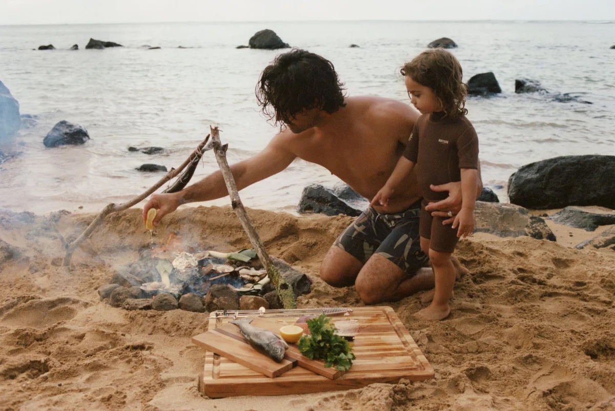 Seatopia founders cooking fresh-caught seafood on the beach